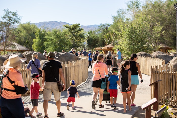 People walking across Rhino Savanna Boardwalk